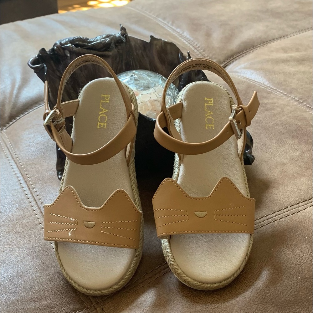 A pair of cute girl sandals. Size 10. Brand new condition.